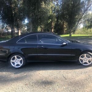 Elegant Black Coupe with Silver Wheels